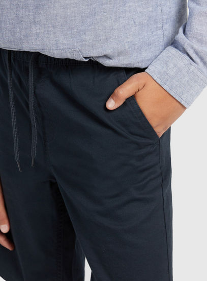 Solid Mid-Rise Shorts with Drawstring Closure and Pockets