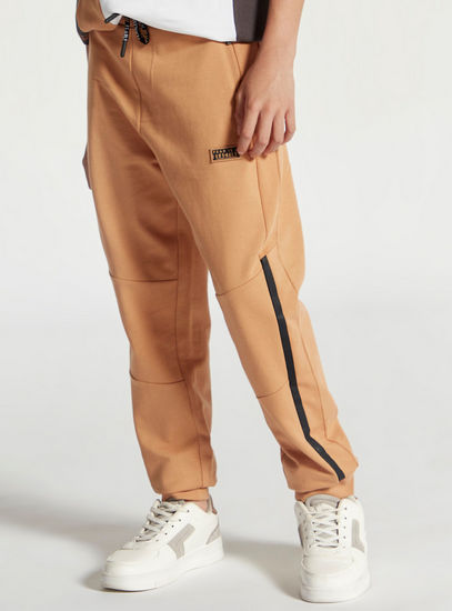 Solid Mid-Rise Panel Jog Pants with Drawstring Closure and Pockets