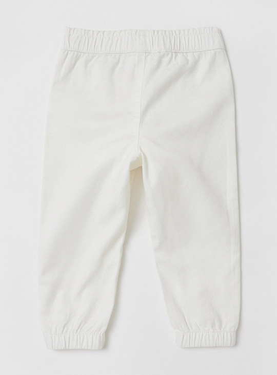 Solid Mid-Rise Trousers with Frill and Bow Detail