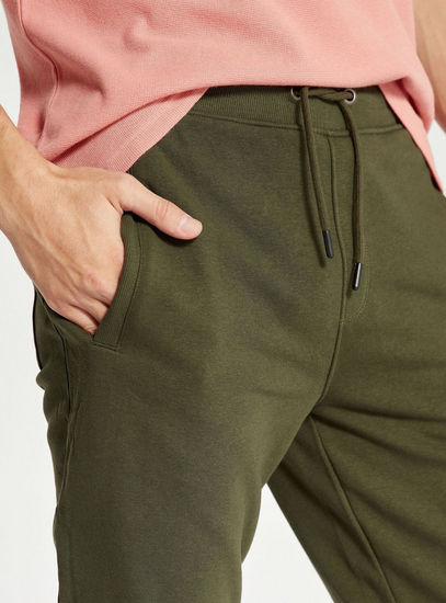 Solid Mid-Rise 3/4 Jog Pants with Drawstring Closure and Pockets