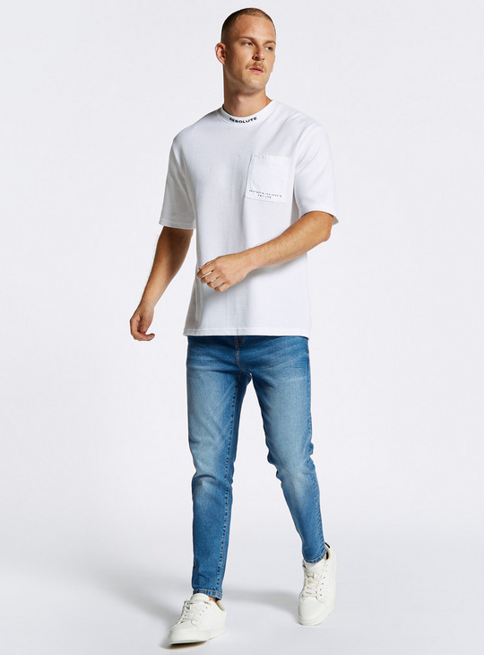Solid Carrot Fit Mid-Rise Jeans with Button Closure