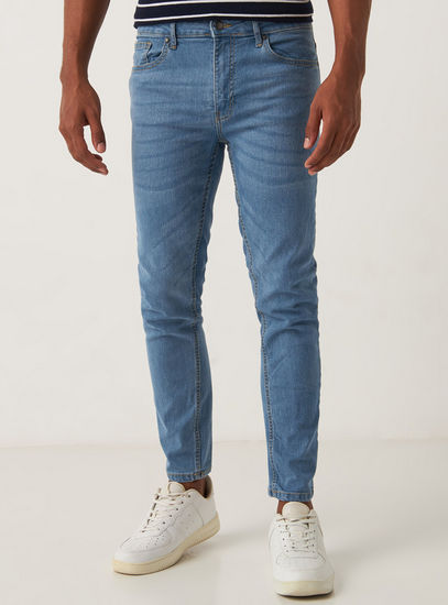 Solid Mid-Rise Skinny Fit Jeans with Pockets and Button Closure