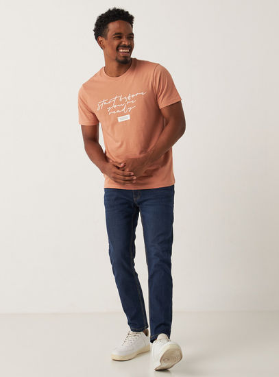 Solid Mid-Rise Skinny Fit Jeans with Pockets and Button Closure
