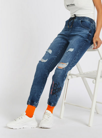 Distressed High-Rise Denim Joggers with Drawstring Closure and Pockets