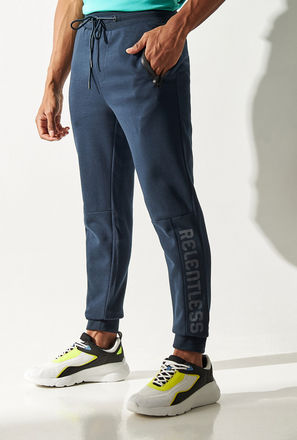 Solid Mid-Rise Slim Fit Joggers with Drawstring Closure and Mesh Panel