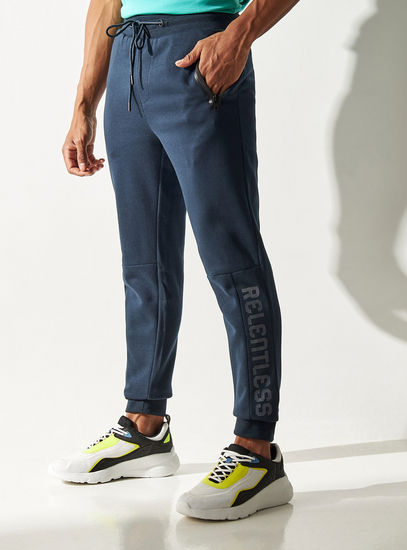 Solid Mid-Rise Slim Fit Joggers with Drawstring Closure and Mesh Panel-Joggers & Shorts-image-0