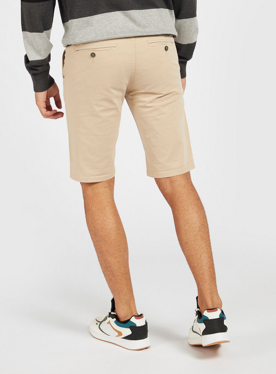 Solid Mid-Rise Chino Shorts with Pockets and Zip Closure