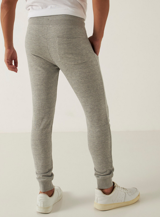 Solid Skinny Fit Mid-Rise Joggers with Drawstring Closure