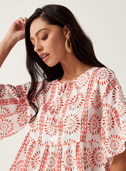 Printed Round Neck Top with Tie-Up Detail and Elbow Flared Sleeves