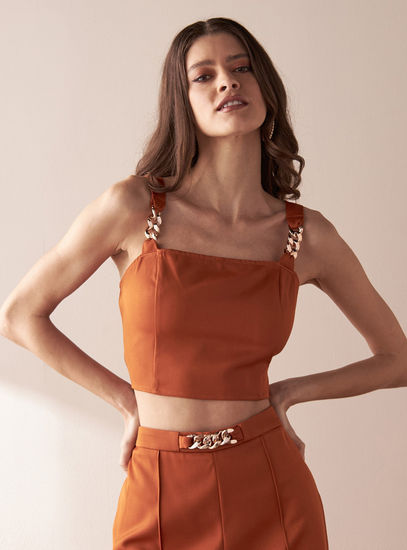 Solid Sleeveless Crop Top with Chain Detail and Zip Closure