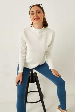 Ribbed High Neck Top with Long Sleeves and Button Closure