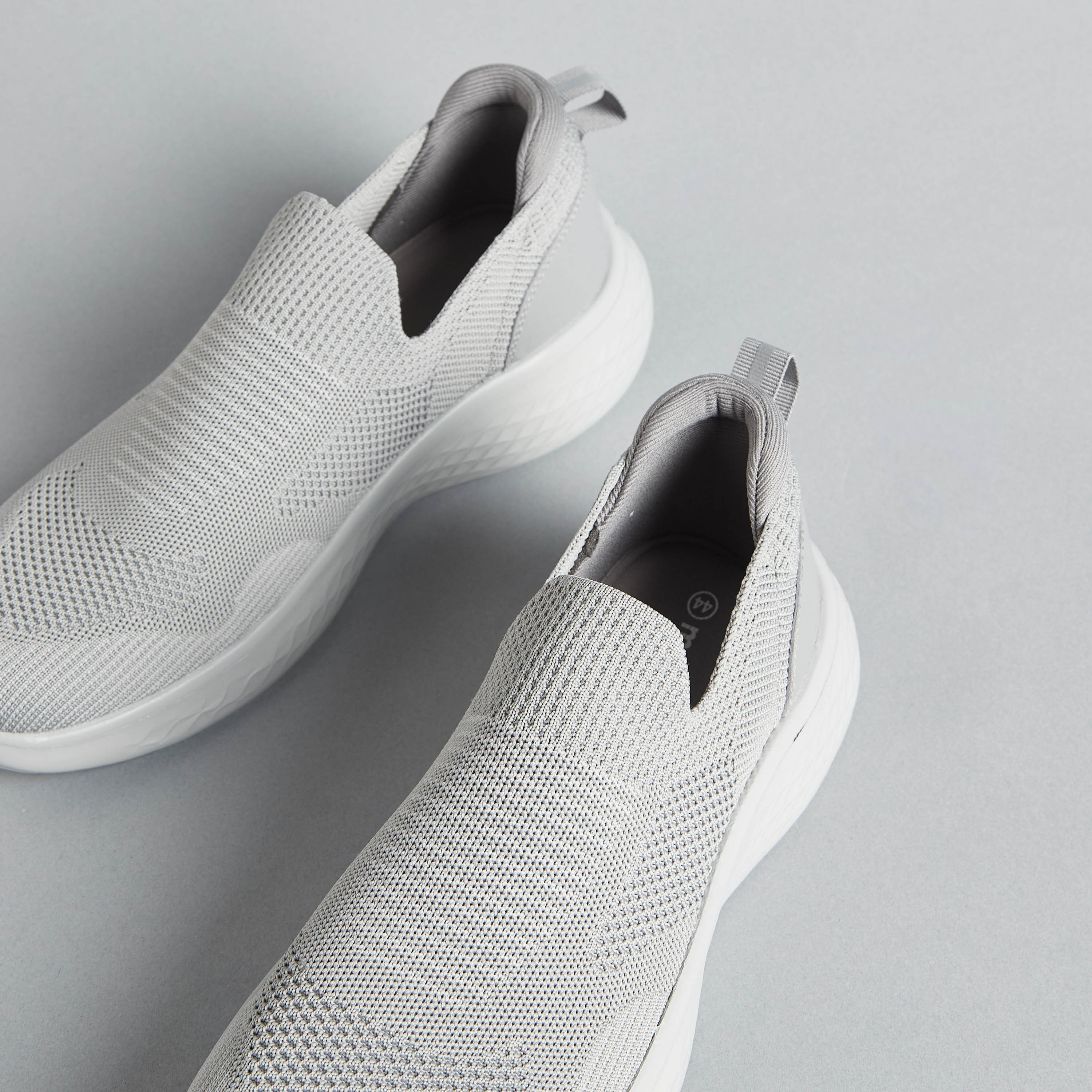 flyknit slip on sneakers