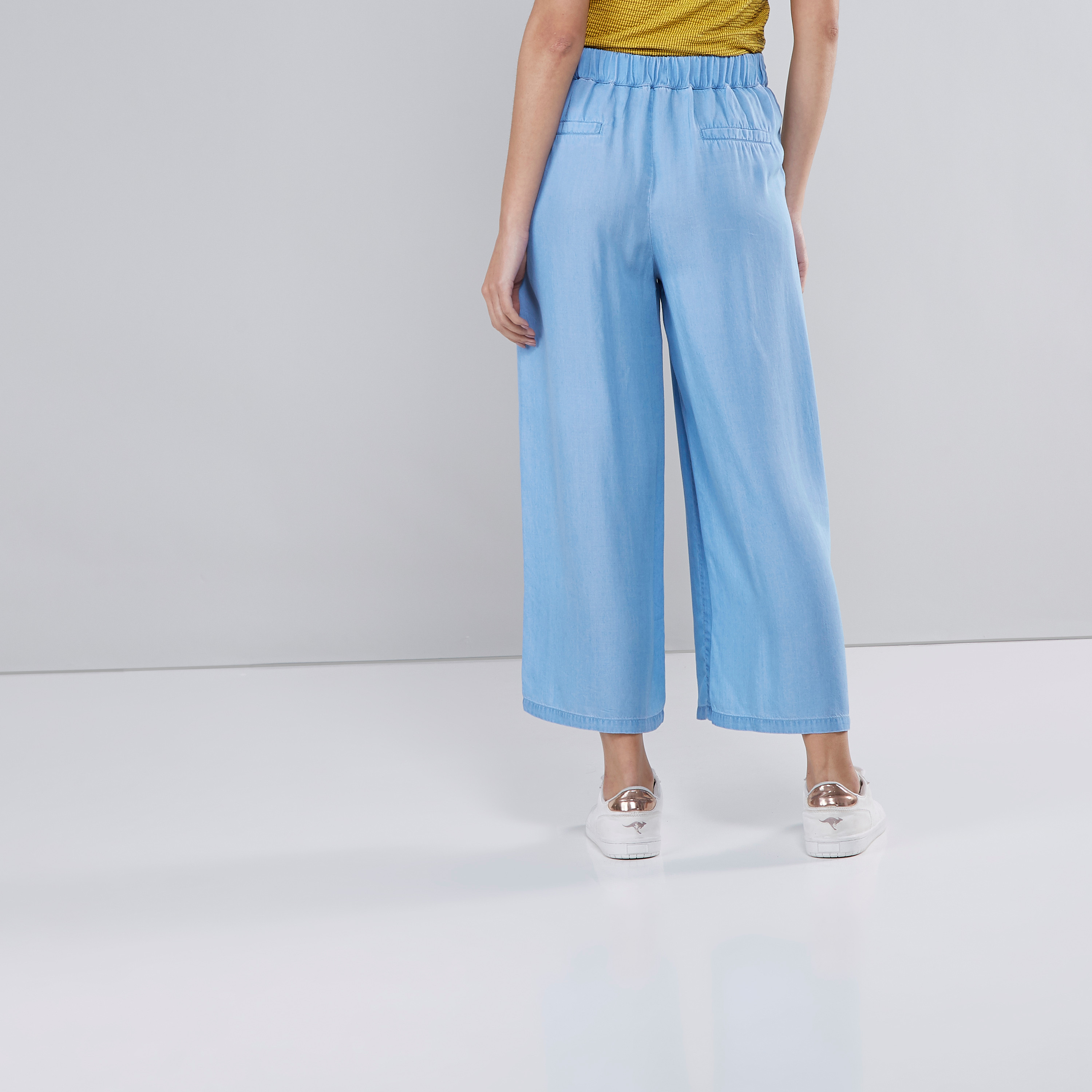 Shop Wide Fit Solid Denim Palazzo Pants with Front-Knot