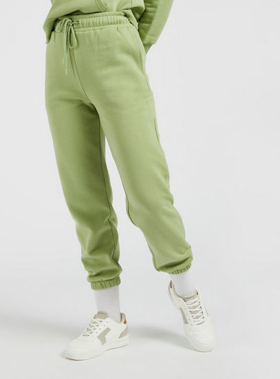 Solid Mid-Rise Ankle Length Jog Pants with Elasticated Hem and Pockets